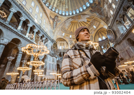 man smiling inside of beautiful interior of hagia sophia 93002404