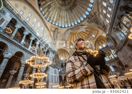man smiling inside of beautiful interior of hagia sophia man smiling inside of beautiful interior of hagia sophia 93002421