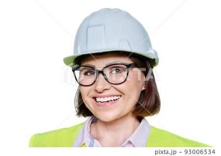 Female industrial worker in protective hard hat and vest on white isolated background Female industrial worker in protective hard hat and vest on white isolated background 93006534