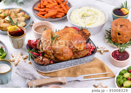 Christmas festive dinner with traditional dishes Christmas festive dinner with traditional dishes 93008329