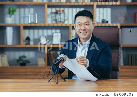 Portrait of Asian blogger, man recording sound on torn paper microphone, asmr sound Portrait of Asian blogger, man recording sound on torn paper microphone, asmr sound 93009908
