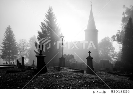 Spooky grave yard with and old church Spooky grave yard with and old church 93018836