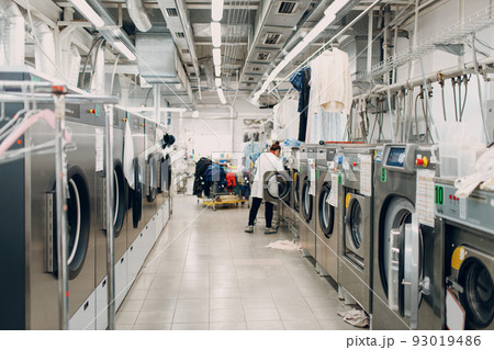 Dry cleaning clothes. Clean cloth row washing machines chemical process. Laundry industrial dry-cleaning. 93019486