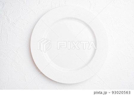 Empty white plate porcelain with copy space for text or food with copy space for text or food, top view flat lay , on white stone table background 93020563