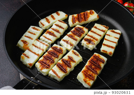Halloumi fried cheese, on old dark rustic table background 93020631