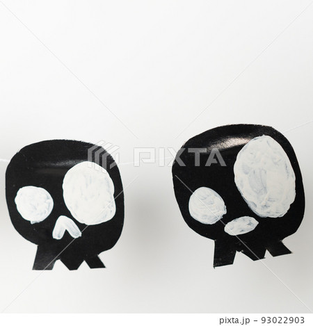 Bats and skulls black on white background, place to write greeting. 93022903