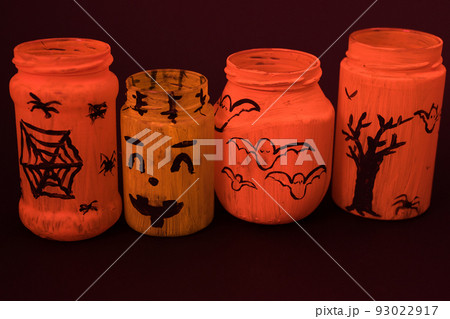 Painted jar decoration for Halloween, children's crafts for the Halloween holiday. Painted jar decoration for Halloween, children's crafts for the Halloween holiday. 93022917