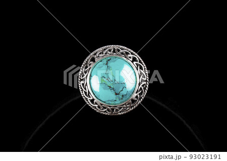 Silver ring with turquoise stone on black background Silver ring with turquoise stone on black background 93023191