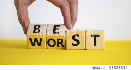 Best or worst symbol. Businessman turns wooden cubes and changes the word best to worst. Beautiful yellow table, white background, copy space. Business and best or worst concept. Best or worst symbol. Businessman turns wooden cubes and changes the word best to worst. Beautiful yellow table, white background, copy space. Business and best or worst concept. 93023352