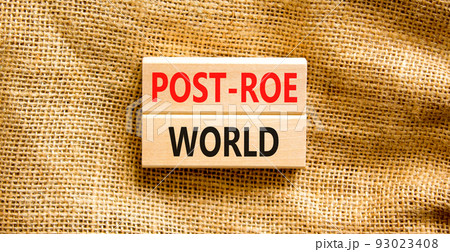 Roe vs Wade post-Roe world symbol. Concept words Post-Roe world on wooden blocks on a beautiful canvas background. Businessman hand. Business and Roe vs Wade post-Roe world concept. Copy space. Roe vs Wade post-Roe world symbol. Concept words Post-Roe world on wooden blocks on a beautiful canvas background. Businessman hand. Business and Roe vs Wade post-Roe world concept. Copy space. 93023408