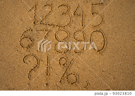 Numbers one to ten written on a sandy beach. Numbers one to ten written on a sandy beach. 93023810