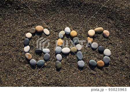 word gas on sandy beach. Energy and fuel concept 93023963