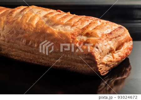 One baked homemade bun with apple jam in electric oven: close up 93024672