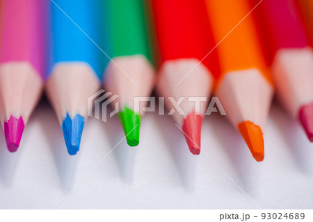 Close up: many different colored pencils on white surface - macro Close up: many different colored pencils on white surface - macro 93024689