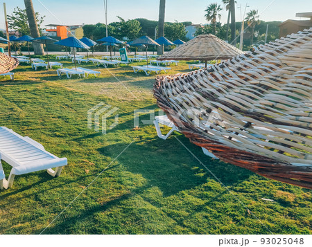 Bamboo beach umbrella on blue sky background Bamboo beach umbrella on blue sky background 93025048
