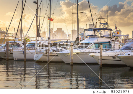 Miami sea habor at golden sunset with american flag, Florida, USA 93025973