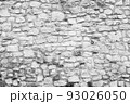 Black and white stone wall for background design. Vintage of stone backdrop. Natural stone wall textured background for a poster, calendar, screensaver, wallpaper, postcard, banner, cover, website 93026050