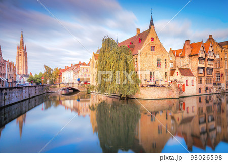 Rozenhoedkaai canal reflection at sunrise and blurred clouds, Bruges 93026598