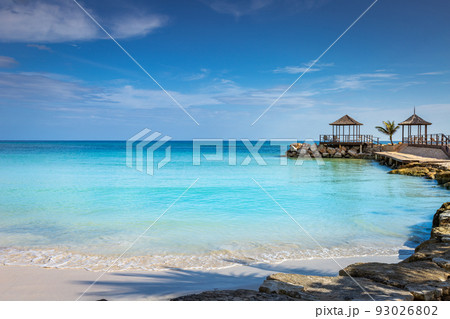 Caribbean beach with gazebo and lounge chairs, Montego Bay, Jamaica 93026802