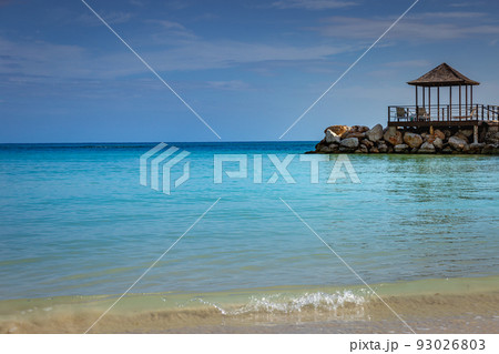 Caribbean beach with gazebo and lounge chairs, Montego Bay, Jamaica Caribbean beach with gazebo and lounge chairs, Montego Bay, Jamaica 93026803