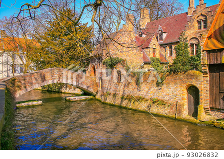 Peaceful Canal in idyllic Bruges with bridge, Belgium 93026832