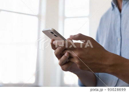 Male hands using modern smart phone, close up cropped shot 93028699