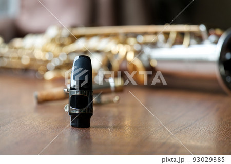Soprano Saxophone Mouthpiece, Closeup Woodwind Instrumental Equipment on Blur Saxophone Background. 93029385