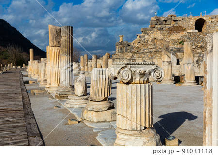 Ruins of the Upper Agora at Ephesus ancient site in Turkey. View of fragments of columns; with Sacred Street and Odeon Ruins of the Upper Agora at Ephesus ancient site in Turkey. View of fragments of columns; with Sacred Street and Odeon 93031118