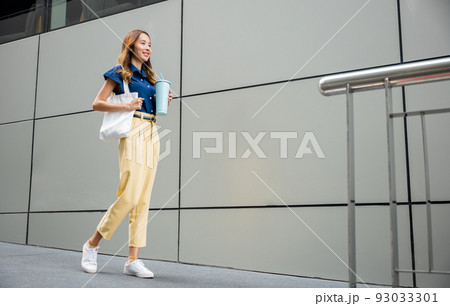 business woman confident smiling with cloth bag holding steel thermos tumbler mug water glass business woman confident smiling with cloth bag holding steel thermos tumbler mug water glass 93033301