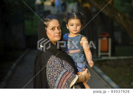 Young mother with her two years girl  in her hug 93037926