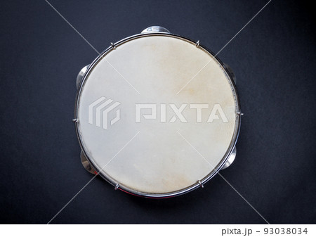 Brazilian tambourine isolated on black background Brazilian tambourine isolated on black background 93038034