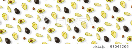 Avocado banner. Background made from isolated Avocado pieces on white background. Flat lay of fresh ripe avocados and avacado pieces. Avocado banner. Background made from isolated Avocado pieces on white background. Flat lay of fresh ripe avocados and avacado pieces. 93045206