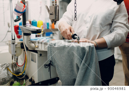 Dry cleaning clothes and removing dirty spot pollution process. Clean cloth chemical process. Laundry industrial dry-cleaning. Dry cleaning clothes and removing dirty spot pollution process. Clean cloth chemical process. Laundry industrial dry-cleaning. 93046981