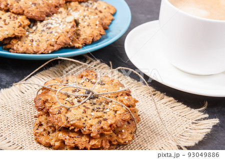 Fresh baked oatmeal cookies on jute canvas. Delicious crunchy dessert Fresh baked oatmeal cookies on jute canvas. Delicious crunchy dessert 93049886