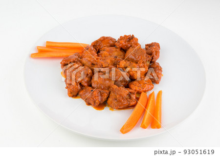 Boneless chicken wings with buffalo sauce and carrots 93051619