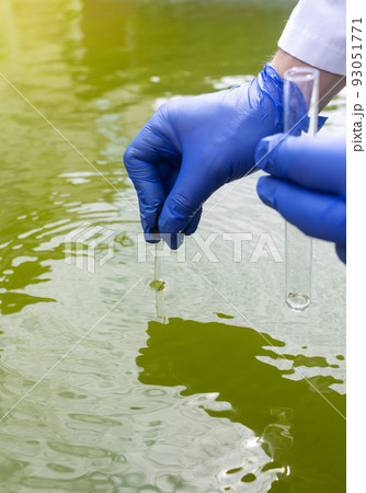 Water sample. Treatment facilities. Quality control of water that has been purified and processed. The laboratory assistant collects material for research. Liquid in a test tube. Sewage treatment 93051771