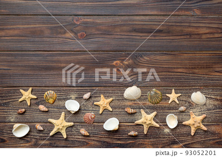 Summer time concept Flat lay composition with beautiful starfish and sea shells on colored table, top view with copy space for text Summer time concept Flat lay composition with beautiful starfish and sea shells on colored table, top view with copy space for text 93052201