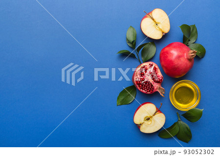Flat lay composition with symbols jewish Rosh Hashanah holiday attributes on colored background, Rosh hashanah concept. New Year holiday Traditional. Top view with copy space Flat lay composition with symbols jewish Rosh Hashanah holiday attributes on colored background, Rosh hashanah concept. New Year holiday Traditional. Top view with copy space 93052302