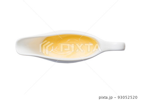 Creamy cheese sauce in the white sauceboat. cheese sauce isolated on white background. top view Creamy cheese sauce in the white sauceboat. cheese sauce isolated on white background. top view 93052520