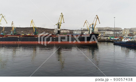 Flight over group of ships on berths of Murmansk seaport waiting for coal loading 93057438