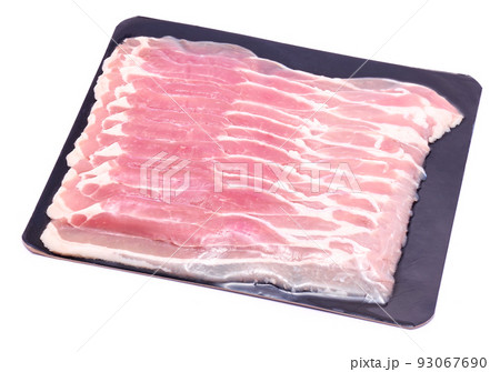 Bacon strips on black package paper for wholesales isolated on white background Bacon strips on black package paper for wholesales isolated on white background 93067690