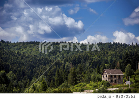 unfinished wooden cottage in Carpatian spruce forest, Ukraine unfinished wooden cottage in Carpatian spruce forest, Ukraine 93070563
