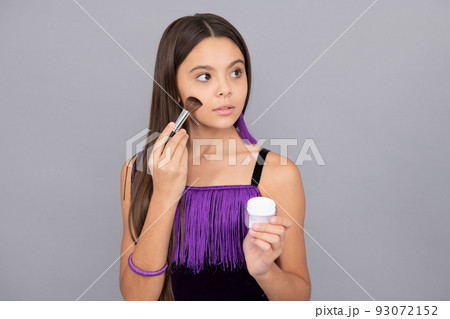 Make-up girl apply facial powder with makeup brush grey background, cosmetic makeover Make-up girl apply facial powder with makeup brush grey background, cosmetic makeover 93072152