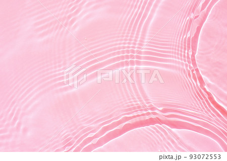 Background, texture of transparent pink water with ripples and waves 93072553