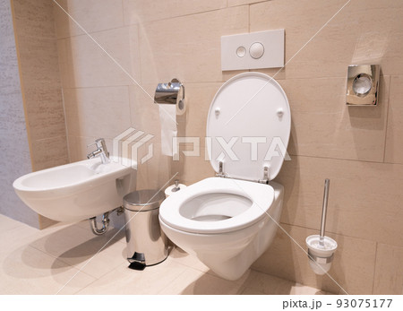 modern toilet with toilet, bidet and toiletries modern toilet with toilet, bidet and toiletries 93075177