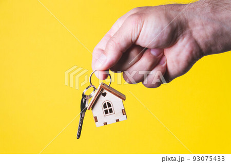 Buying a house. The buyer receives the key to the property. Buying a house. The buyer receives the key to the property. 93075433