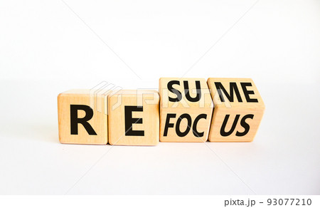 Refocus and resume symbol. Businessman turned cubes and changed the word 'refocus' to 'resume'. Beautiful white table, white background. Business refocus and resume concept. Copy space. Refocus and resume symbol. Businessman turned cubes and changed the word 'refocus' to 'resume'. Beautiful white table, white background. Business refocus and resume concept. Copy space. 93077210