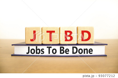 JTBD jobs to be done symbol. Concept words JTBD jobs to be done on wooden blocks and book on beautiful white background. Business and JTBD jobs to be done concept. Copy space. 93077212