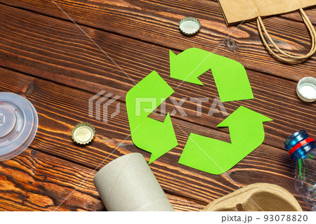 Eco concept with recycling symbol on table background top view Eco concept with recycling symbol on table background top view 93078820