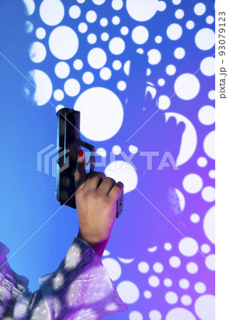Lady holding pistol gun 93079123